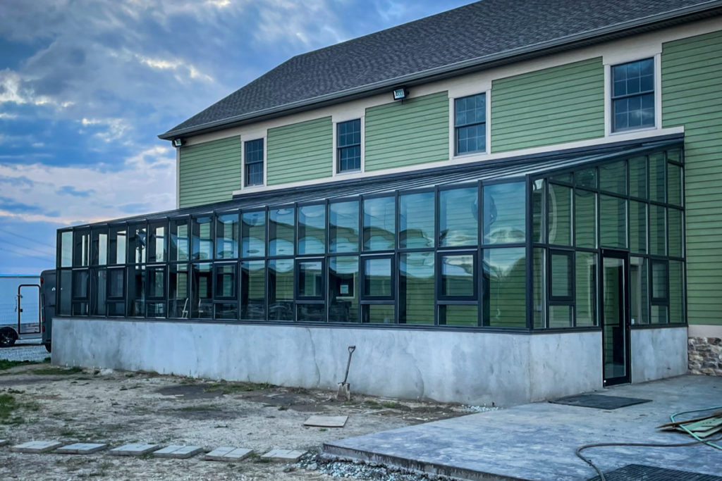 Greenhouse on Side of Home